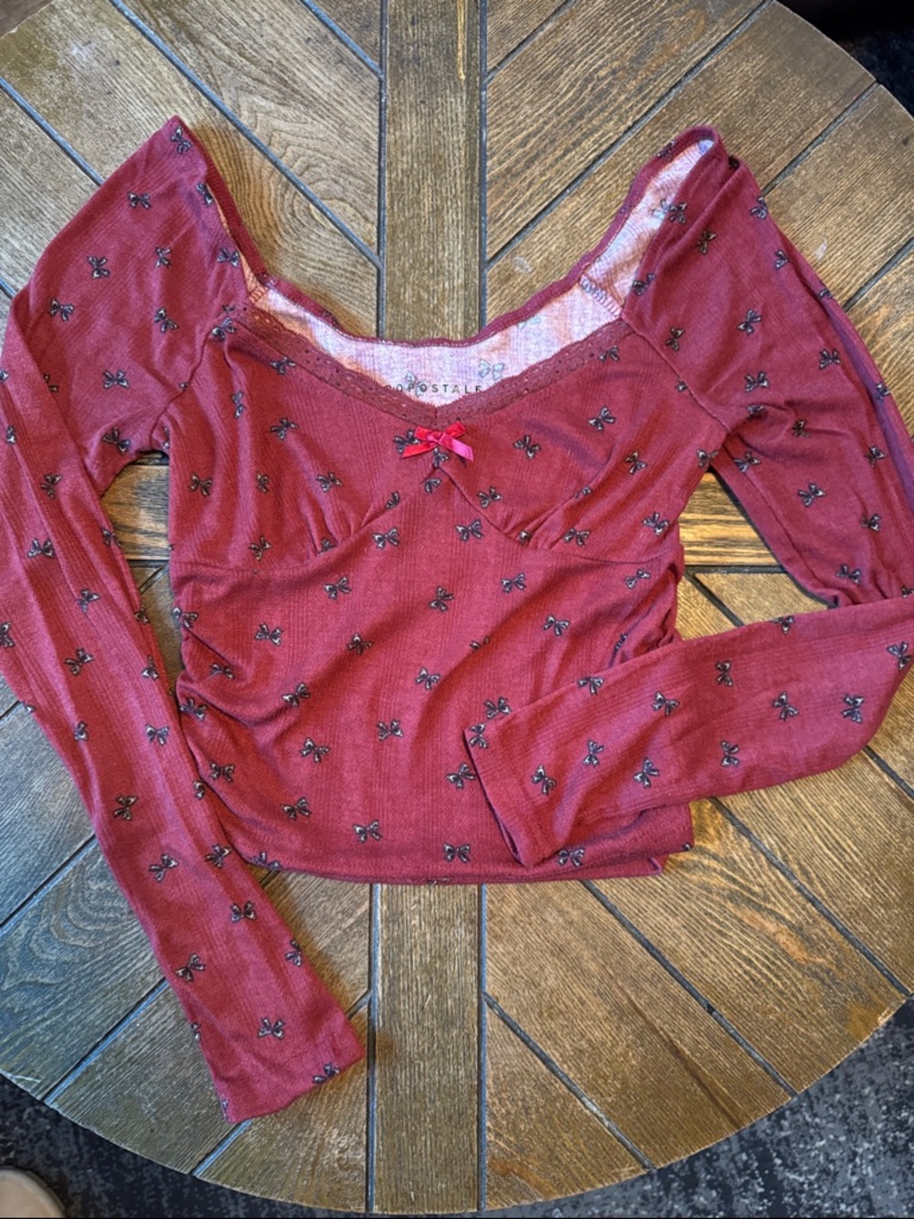 Aeropostale Burgundy Long Sleeve Cropped Top with Black Bow Print